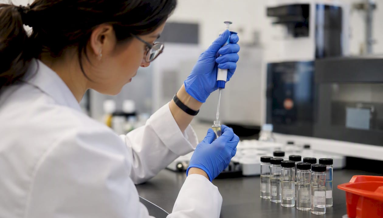 Hands preparing sample for GC-MS test