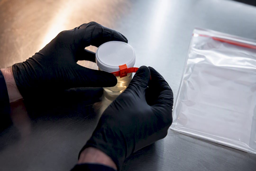 Sealed specimen container in probation testing room