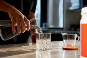 Water being poured beside an anonymous detox drink