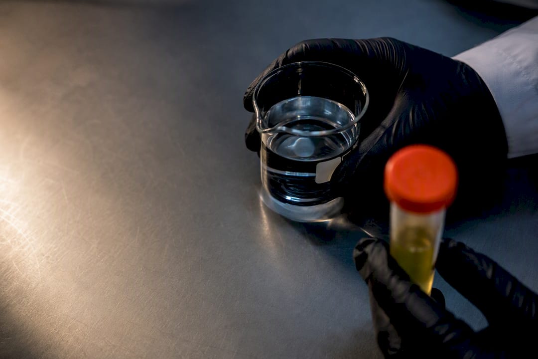 Toxicology lab comparing prepared solution and specimen