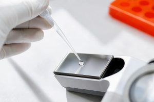 Urine sample droplet on refractometer prism